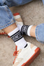 CHAUSSETTES UNISEXES BLANCHES À BANDES NOIRES "HONESTMIND"